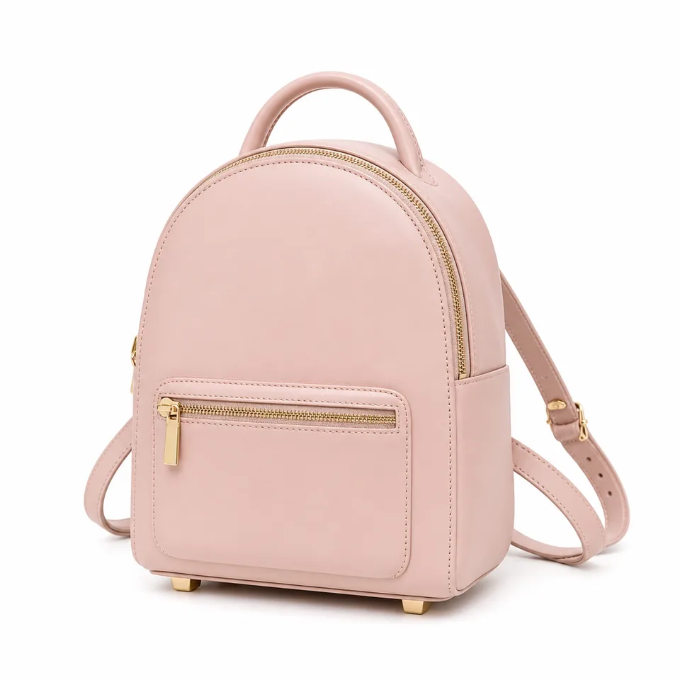 Blush pink mini PU leather backpack with top handle and gold-tone zippers