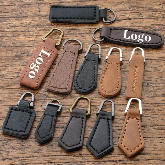 Leather zipper pull tabs with embossed logo