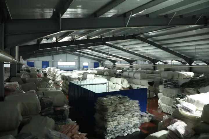 Compressed bales stacked for container loading