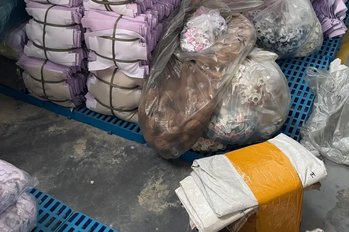 Pastel-colour stock backpacks baled for shipment
